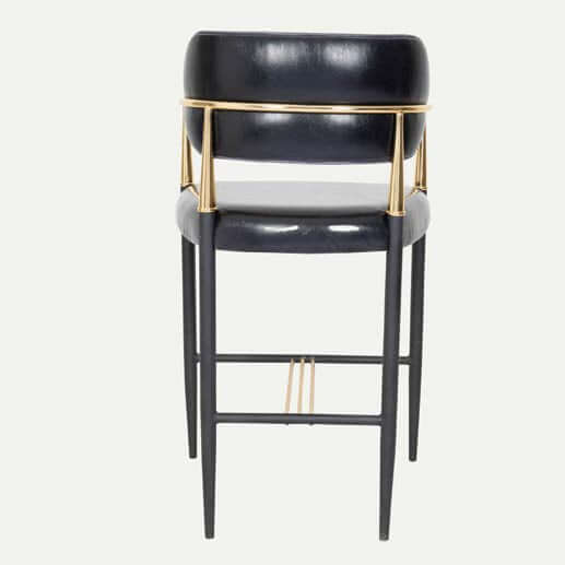 Lux Royale Bar Stool Indulge in the epitome of luxury and elegance with the Lux Royale Bar Stool. This sophisticated stool is crafted with a striking combination of black leather and gleaming gold accents, designed to bring a touch of opulence to any bar